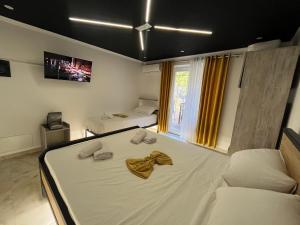 Ліжко або ліжка в номері Hotel Davids