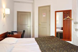 Postel nebo postele na pokoji v ubytování Gotthard Residents