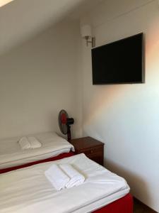 Postel nebo postele na pokoji v ubytování Gotthard Residents
