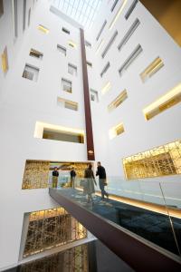 a group of people walking down a building at Mandarin Oriental, Barcelona in Barcelona