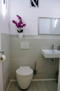 a bathroom with a toilet and a sink at Barrierefreies Apartment in Bad Salzuflen in Bad Salzuflen