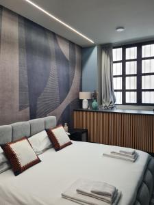 Postel nebo postele na pokoji v ubytování Serendipity Rooms - Navigli