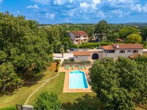 an aerial view of a house with a swimming pool at Villa Catarina by IstriaLux in Kringa