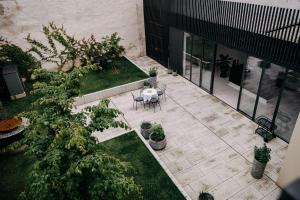 an overhead view of a patio with a table and plants at Villa Elizabeth - Mansard Apartment for 4 in Slovenj Gradec