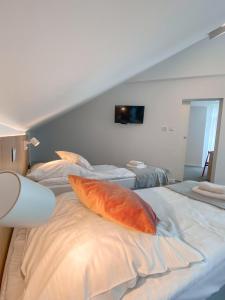 Postel nebo postele na pokoji v ubytování Ośrodek Tulipan + 10 fotografií