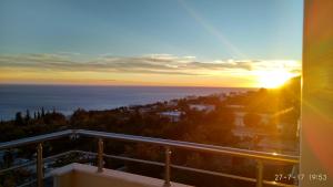 a view of the sunset from a balcony at El Doro Rooms in Dhërmi