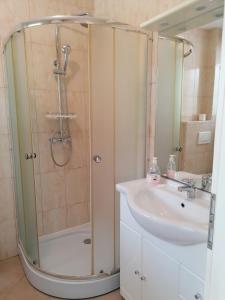 a bathroom with a shower and a sink at Apartment Cindy in Lovran +34 photos