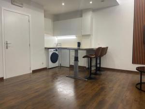 a kitchen with a table and chairs in a room at Boutique Diamond Apartments in Antwerp