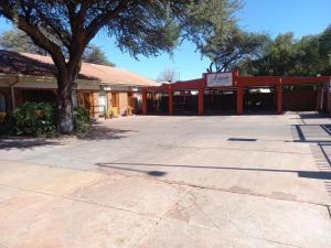 an empty parking lot in front of a building at Acacia Gastehuis in Kathu +61 photos