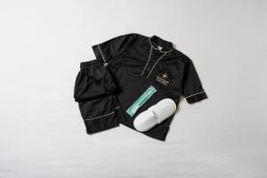 a black jacket is sitting on a white surface at THE SINGULARI HOTEL & SKYSPA at UNIVERSAL STUDIOS JAPAN in Osaka +105 photos