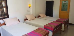 Letto o letti in una camera di AHSRAM Accommodations