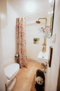 a small bathroom with a toilet and a sink at Country house Harmonia in Modra +43 photos