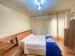 Giường trong phòng chung tại Casco antiguo! nuevo