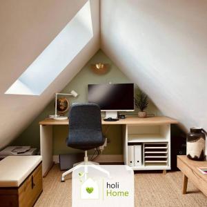 a room with a desk with a computer and a chair at H3 Charmante maison sur la Vilaine près du Château in Vitré +37 photos