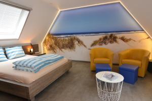 Postel nebo postele na pokoji v ubytování B&B wellness Sea Nat voor Naturisten