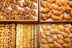 a display of breads and pastries in a bakery at Hotel Splendid in Madonna di Campiglio