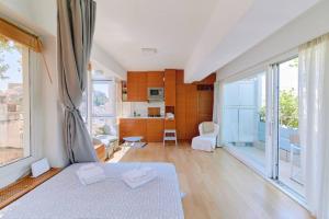 Ένα ή περισσότερα κρεβάτια σε δωμάτιο στο 360 view in roof top appartment with patio