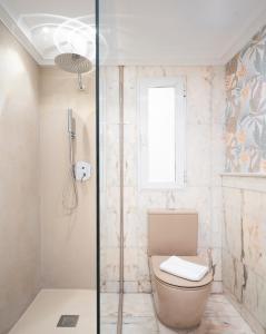 a bathroom with a toilet and a shower at EnjoyGranada RECOGIDAS HOMES in Granada +31 photos