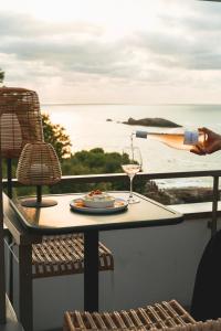 a glass of wine is being poured on a table at Hôtel de La Plage in Biarritz