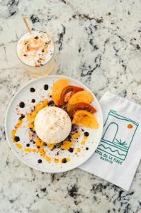 a bowl of food on a table with a drink at Hôtel de La Plage in Biarritz