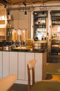 a kitchen with a counter with some food on it at Hôtel de La Plage in Biarritz