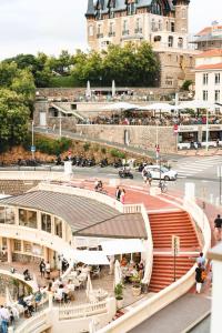 a view of a city with a building in the background at Hôtel de La Plage in Biarritz
