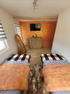 A bed or beds in a room at Apartman Zlatar-Vasiljevic