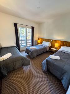 Кровать или кровати в номере HOTEL DINKO