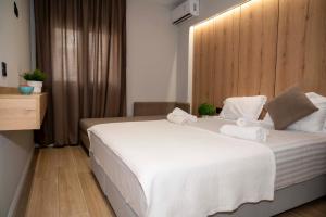 Postel nebo postele na pokoji v ubytování RiA BLU DELUXE HOTEL