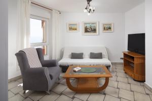 a living room with a couch and a coffee table at Bloque 76 in Torrox