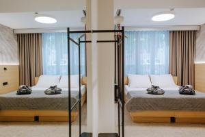 Postel nebo postele na pokoji v ubytování FLORAMARE HEALTH RESORT