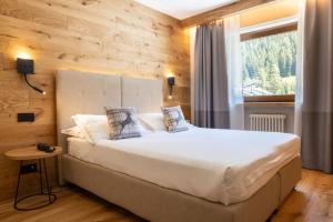 Postel nebo postele na pokoji v ubytování Hotel Relais Des Glaciers - Adults Only