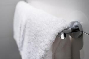 a roll of toilet paper hanging from a shower curtain at Motel One Prague-Florentinum in Prague