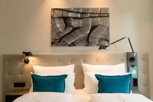 Motel One Linz-Hauptplatz 객실 침대