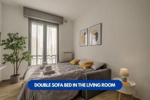 a bedroom with a bed in the living room at Bonomi 7 - AFFITTICA in Milan