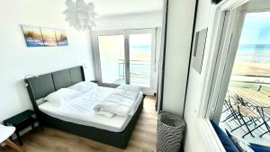 Postel nebo postele na pokoji v ubytování Appart front de mer, 5e étage
