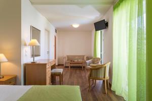 Postel nebo postele na pokoji v ubytování Civitel Attik Rooms & Suites