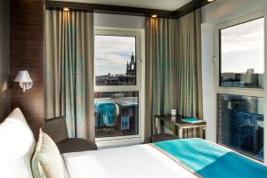 Postel nebo postele na pokoji v ubytování Motel One Newcastle