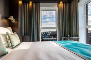 Postel nebo postele na pokoji v ubytování Motel One Newcastle