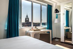 Postel nebo postele na pokoji v ubytování Motel One Newcastle