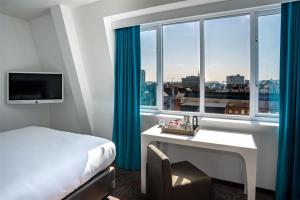 Postel nebo postele na pokoji v ubytování Motel One Newcastle