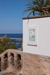 a sign on the side of a building at Hôtel de La Plage in Biarritz
