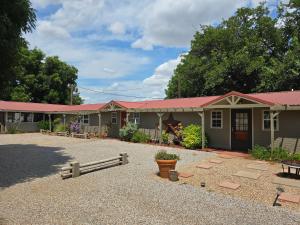 a row of modular homes with red roofs at Roots Retreat in Seymour
