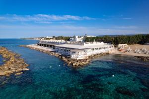 an aerial view of a dock in the water at La Peschiera in Monopoli