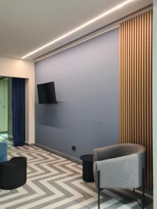 TV a/nebo společenská místnost v ubytování Serendipity Rooms - Navigli