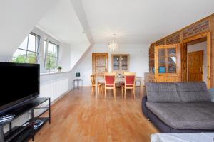 TV a/nebo společenská místnost v ubytování Wohnung auf dem Dorf