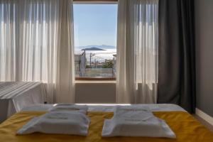 Postel nebo postele na pokoji v ubytování NEKO HOTEL + 168 fotografií