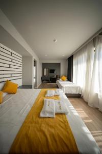 Postel nebo postele na pokoji v ubytování NEKO HOTEL