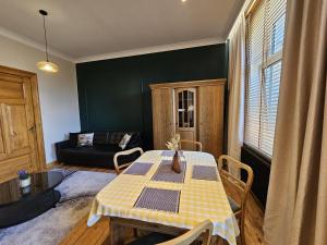 a living room with a table and a couch at Pałucki in Barcin