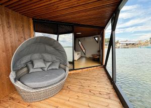 a circular chair on a boat in the water at Grand Holm Marina Ujuvmajad in Haapsalu